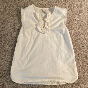 White sleeveless blouse with ruffle detail